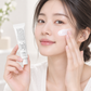 Cream for sensitive skin face – model applying Dr. Althea 345 cream to her cheek